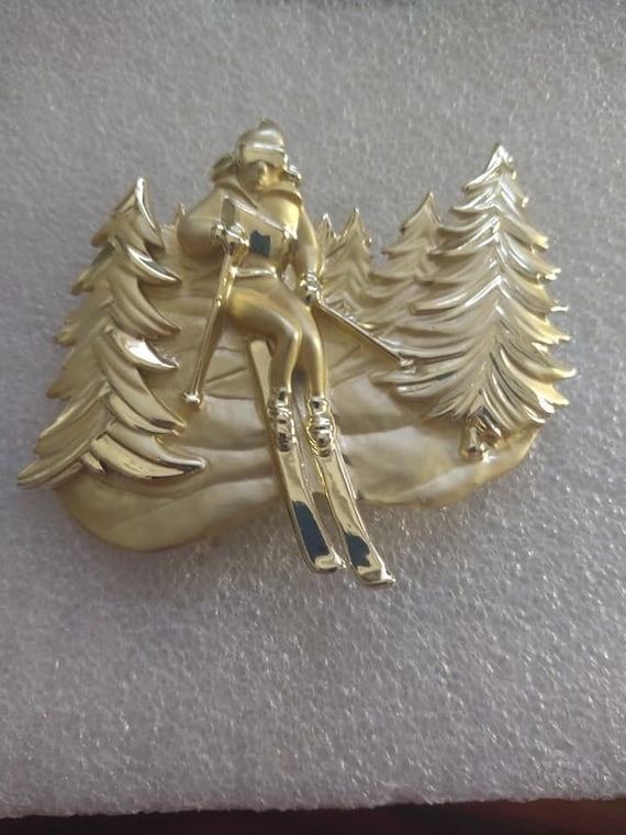 AJC 1980s-era gold-tone female skier brooch