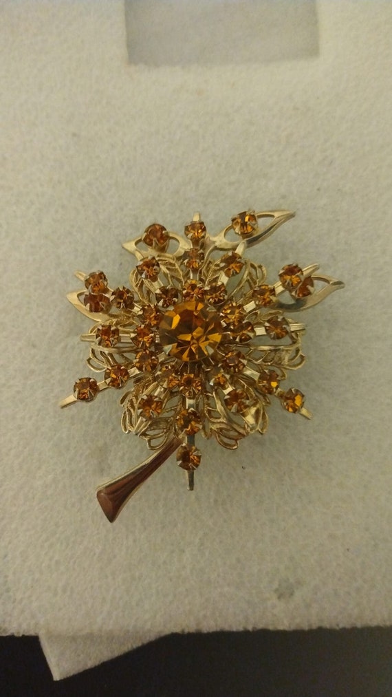 1970s-era Orange rhinestone flower brooch