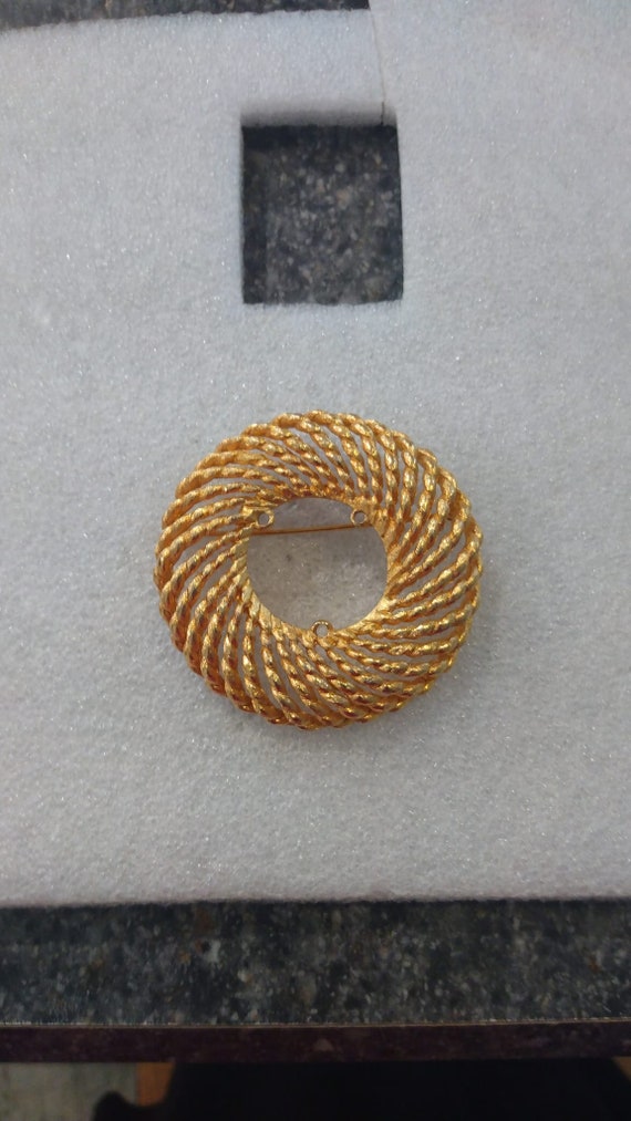 Marcel Boucher open-work gold-tone circle brooch