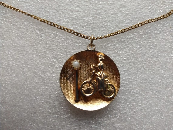 Gold tone woman on a bicycle pendant with genuine… - image 2