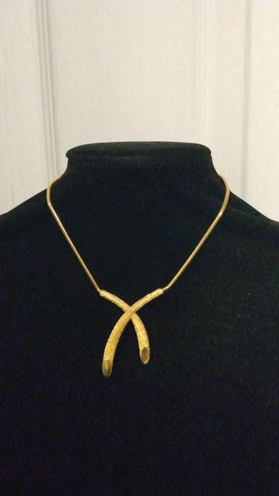 Crown Trifari gold tone X necklace