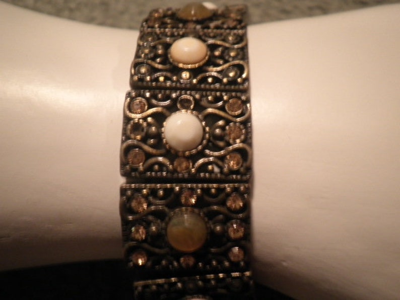 Monet stretch bronze tone bracelet