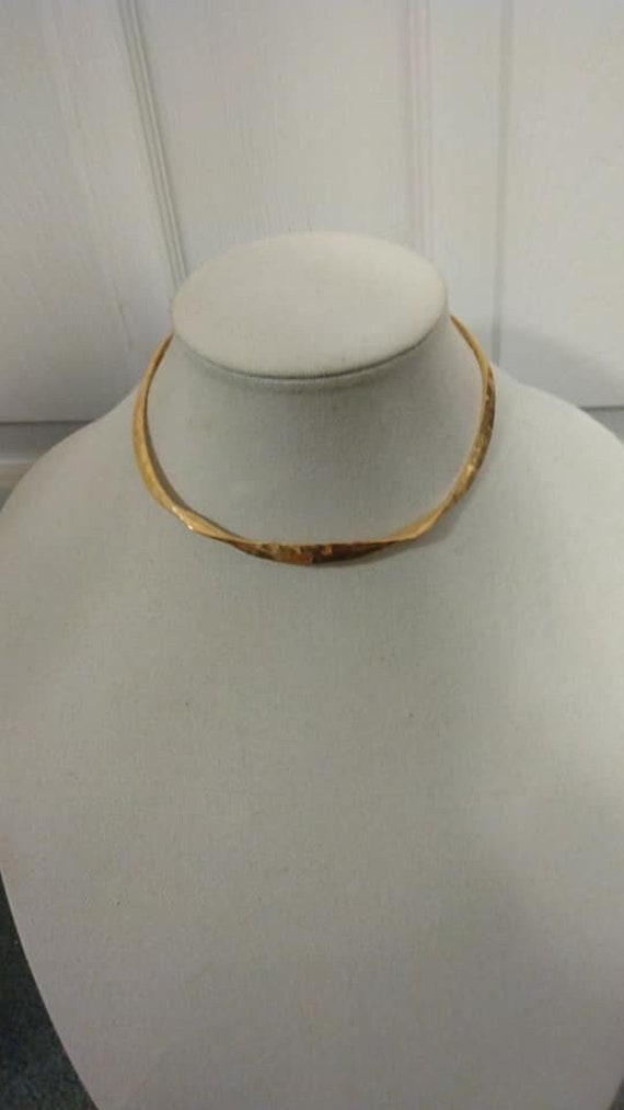 Hand-crafted hammered gold-tone metal neck torc