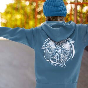 May include: A blue hooded sweatshirt with a white graphic of a skeleton skateboarding and the text "Skateboard Life".
