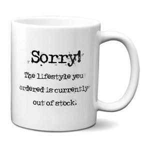 May include: White ceramic coffee mug with a black and white graphic that reads "Sorry! The lifestyle you ordered is currently out of stock."
