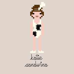 May include: Pixelated illustration of a person in a white swimsuit with black geometric shapes, brown hair, and a white headpiece. The name "katie sanduina" is written in a stylized font below the figure, all on a light tan background.