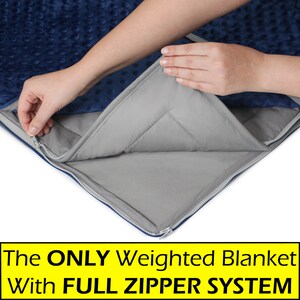 May include: A blue weighted blanket with a zipper that is being opened to reveal the gray weighted inner layer. The text on the image reads "The ONLY Weighted Blanket with FULL ZIPPER SYSTEM".