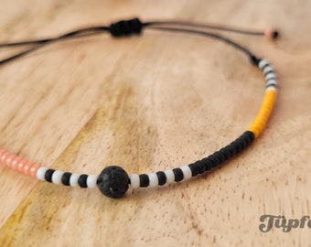 Delicate bracelet with Japanese glass beads and lava stone beads