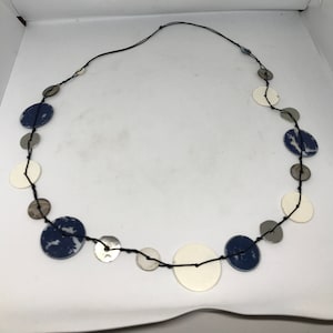 Vintage necklace, shells and metalic circles, one black strand, long length, white blue, not adjustable, pearl necklace