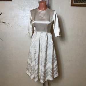 White vintage 80s dress, wedding dress, small size, fit and flare design, half sleeves, midi length, glossy fabric, A-line skirt