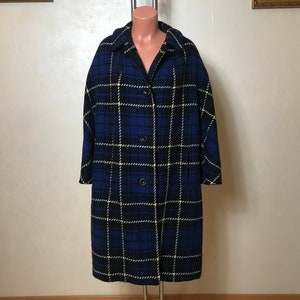 May include: A long blue, black, and white plaid coat with a button closure.