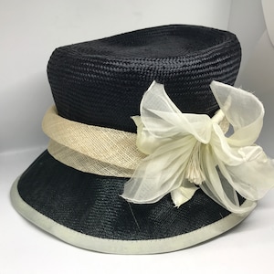 Vintage 90s womens hat, black and white woven straw, synthetic, bucket hat with big flower, one size accessories