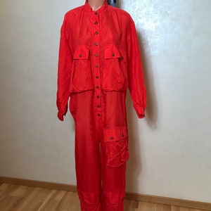 Red vintage overalls made of silk Long sleeves, button up front, large pockets Very light fabric Medium size