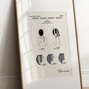 May include: Black and white line drawing of a patent for a fencing mask. The patent is dated 14th November, 1944, and the inventor is Joseph D. Vince. The drawing shows different views of the mask, including a side view, a front view, and a close-up of the mask's design.