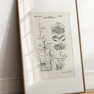 May include: Black and white patent drawing of a coffee maker with the title "Coffee Brewing Apparatus" and the patent number "3,207,474".