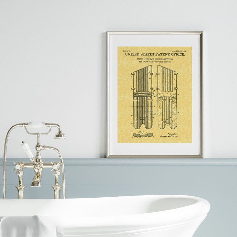May include: A vintage patent drawing for a leg guard for hockey players. The drawing shows a side view of the leg guard, which is made of metal and has a series of vertical bars. The patent number is 1,154,808 and the date is May 19, 1915. The text "UNITED STATES PATENT OFFICE" is at the top of the drawing.