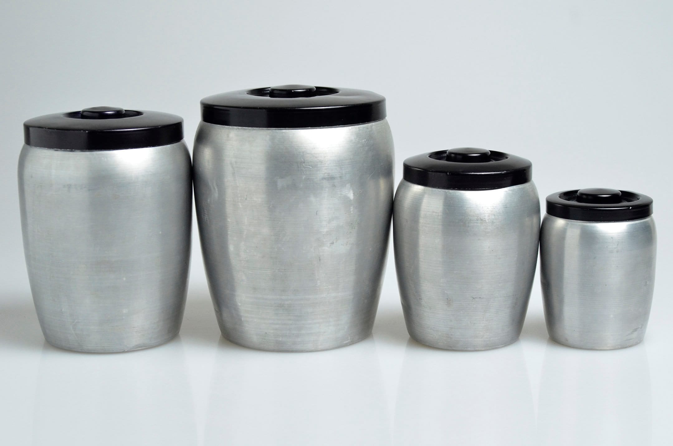 Vintage 4-piece Spun Aluminum Nesting Kitchen Canister Set Vintage 4-piece Spun Aluminum Nesting Kitchen Canister Set