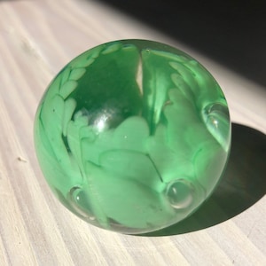 Miniature green Murano glass paperweight