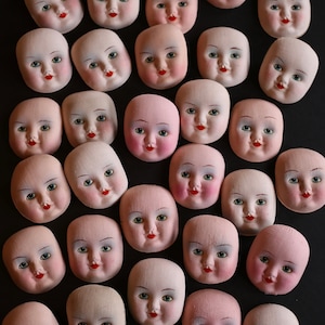 Pack of 5 unused Chad Valley handmade handpainted moulded 1920s cloth doll faces.
