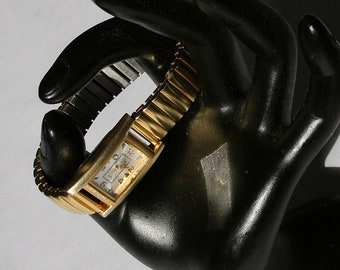 80s gold tone elastic band stainless steel and quartz watch