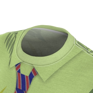 May include: A green t-shirt with a tropical leaf pattern and a red and blue striped tie printed on the front.