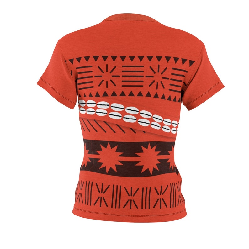 May include: Orange t-shirt with a Polynesian-inspired pattern in black and white. The pattern features geometric shapes, stars, and lines.