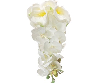 May include: A bouquet of white artificial flowers with yellow centers. The flowers are arranged in a cascading style, with the largest flowers at the top and the smallest flowers at the bottom.