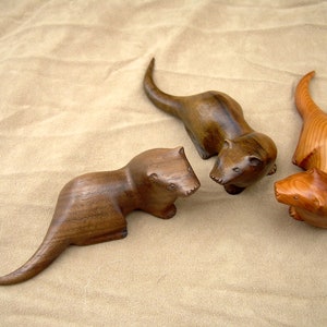 carved wooden otter in walnut. yew or spalted beech image 1
