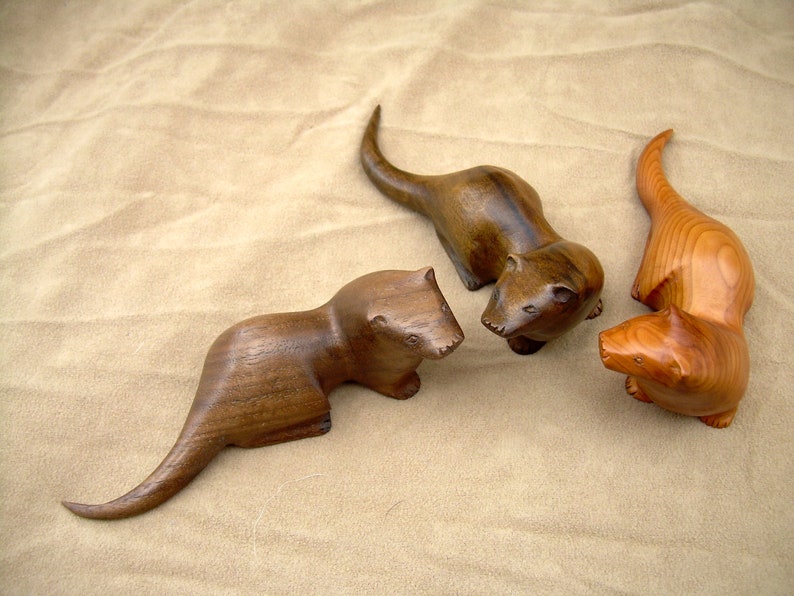 carved wooden otter in walnut. yew or spalted beech image 1