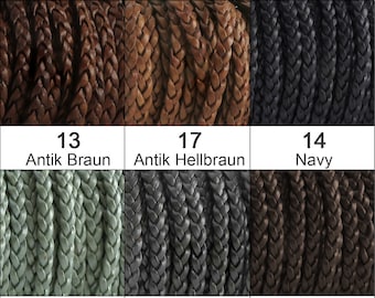 May include: A variety of braided leather cords in different colors, including brown, black, gray, turquoise, and navy. The cords are arranged in a grid pattern with numbers and names for each color.
