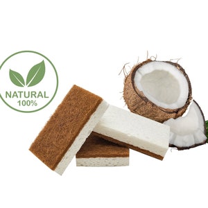 May include: Three brown and white coconut fibre scrubbers with a half coconut shell and green leaves. The scrubbers are made from natural materials and are 100% natural.