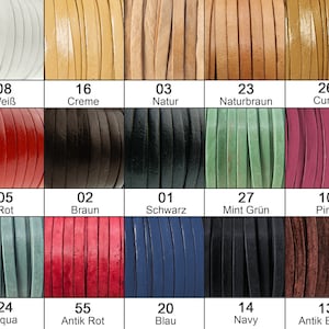 May include: A chart of 14 different colored leather cords. The cords are arranged in a grid of 3 rows and 5 columns. Each cord is labeled with a number and a color name in German. The colors include white, cream, natural, red, brown, black, aqua, antique red, mint green, pink, blue, navy, and antique brown.