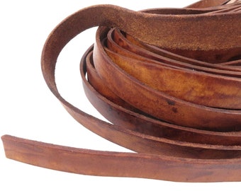 May include: A roll of brown leather cord, coiled and ready for crafting projects. The leather is a rich, dark brown color with a natural, rustic look.