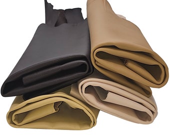 May include: Four rolls of fabric in different colors: brown, beige, light brown, and cream. The fabric is folded and stacked on top of each other.