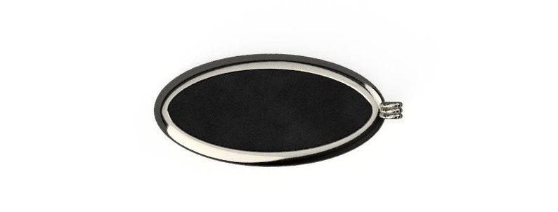 May include: A black oval-shaped key chain with a silver metal rim and a silver metal loop.