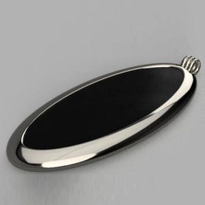May include: A black oval pendant with a silver border and a silver loop at the top.