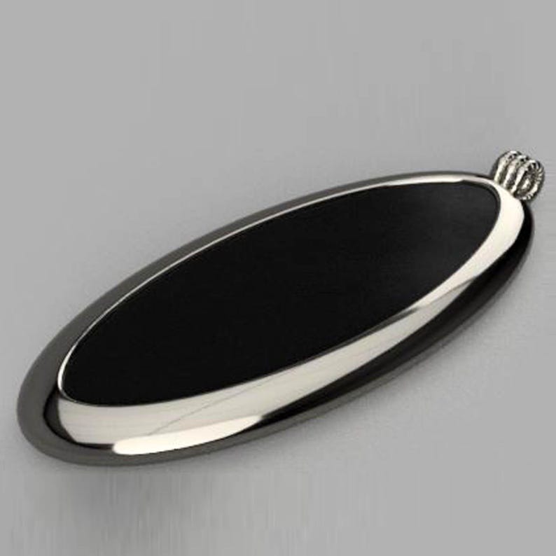 May include: A black oval pendant with a silver border and a silver loop at the top.