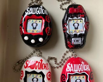 SAW TamaGoth (not real) keychain/bag jewelry, handmade horror movie, Jigsaw, Sawgotchi, 90's pixel art, sculpture