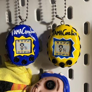 CORALINE Jones Tamagotchi (not real) handmade keychain horror movie 90&#39;s pixel art, sculpture
