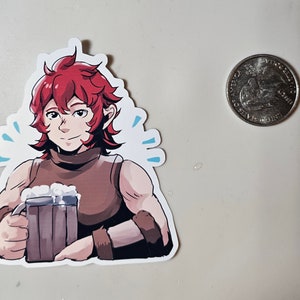 May include: A sticker featuring a cartoon character with red hair holding a tankard of beer. The character is wearing a brown sleeveless shirt and has a friendly expression.