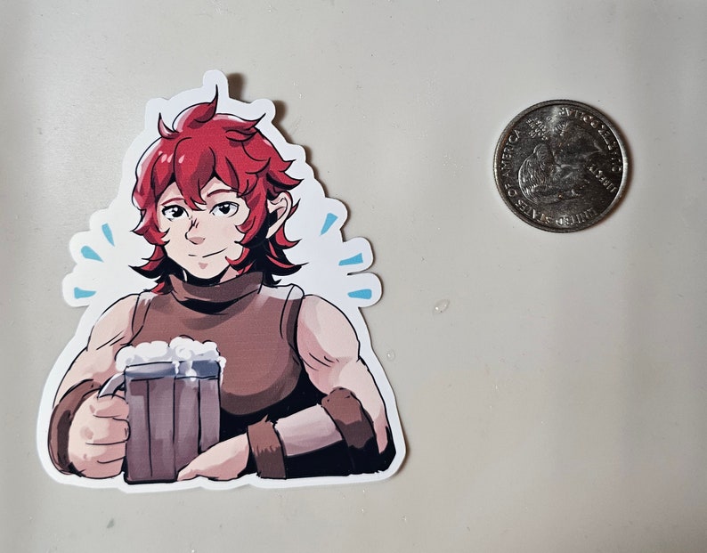 May include: A sticker featuring a cartoon character with red hair holding a tankard of beer. The character is wearing a brown sleeveless shirt and has a friendly expression.