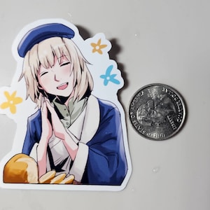 May include: A sticker featuring a cartoon illustration of a young woman with blonde hair wearing a blue beret and a blue and white jacket. She is smiling and holding her hands together in front of her. The sticker has a white background with yellow and blue flowers.