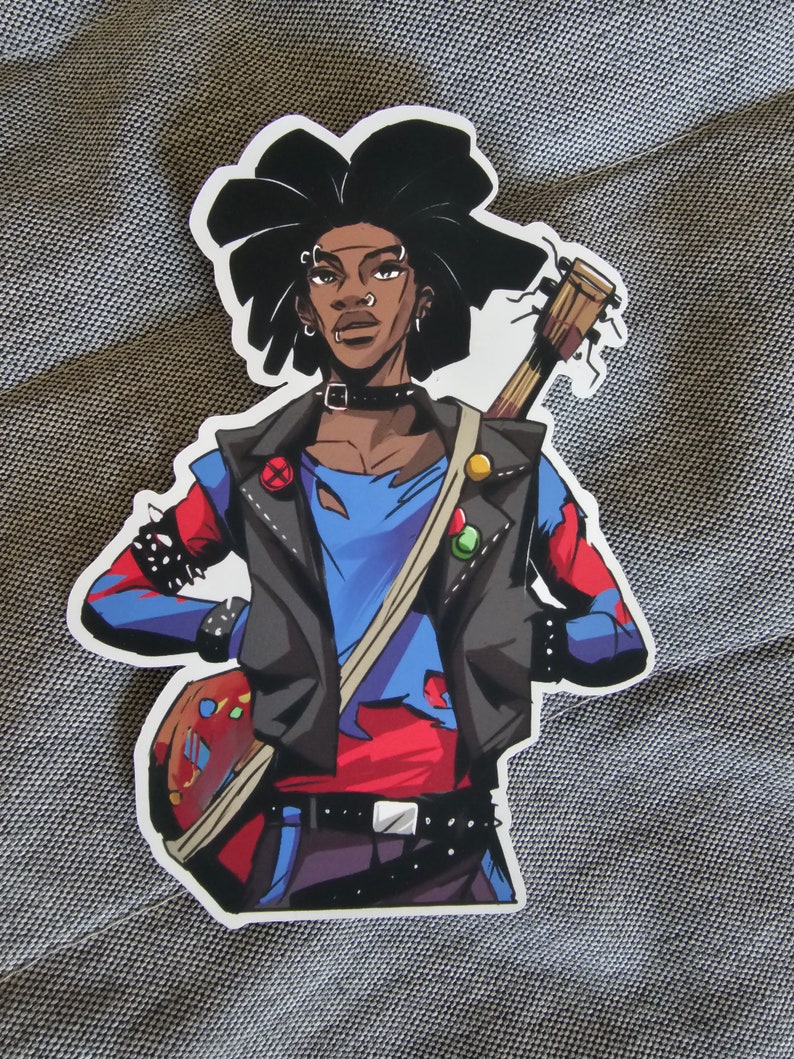 May include: A sticker of a cartoon person with black hair, wearing a blue and red shirt, a black leather jacket, and a guitar. The person has a variety of piercings and is wearing a black choker.