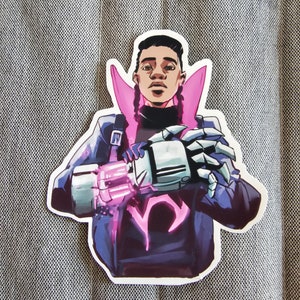 May include: A sticker featuring a cartoon illustration of a person with a pink collar and a robotic arm. The person has dark skin, black hair, and is wearing a dark blue jacket. The robotic arm is silver and has a pink glow.
