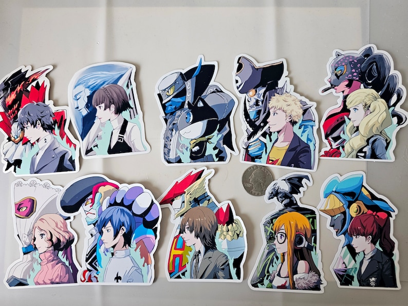 May include: A set of 12 colourful stickers featuring anime characters and their personas. The stickers are printed on white glossy paper and have a rounded rectangular shape.