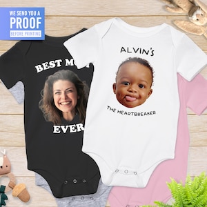 May include: Two baby onesies, one black with a photo of a woman and the text "Best Mom Ever", and one white with a photo of a baby and the text "Alvin's The Heartbreaker".