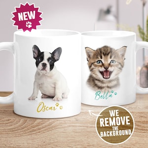 May include: Two white ceramic mugs with personalized pet portraits. The mug on the left features a black and white French bulldog with the name "Oscar" printed below. The mug on the right features a tabby cat with the name "Bella" printed below.