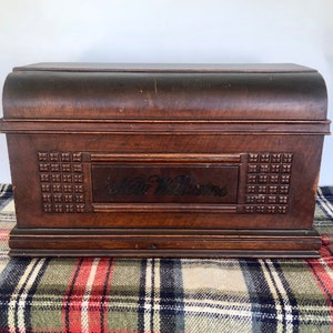 May include: Antique wooden sewing machine case with a carved design and the inscription "Star Williams".