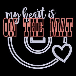 May include: Black graphic with the text "my heart is ON THE MAT" in white and coral. A white heart and a stylized white shape are below the text. The design is likely for yoga or fitness.