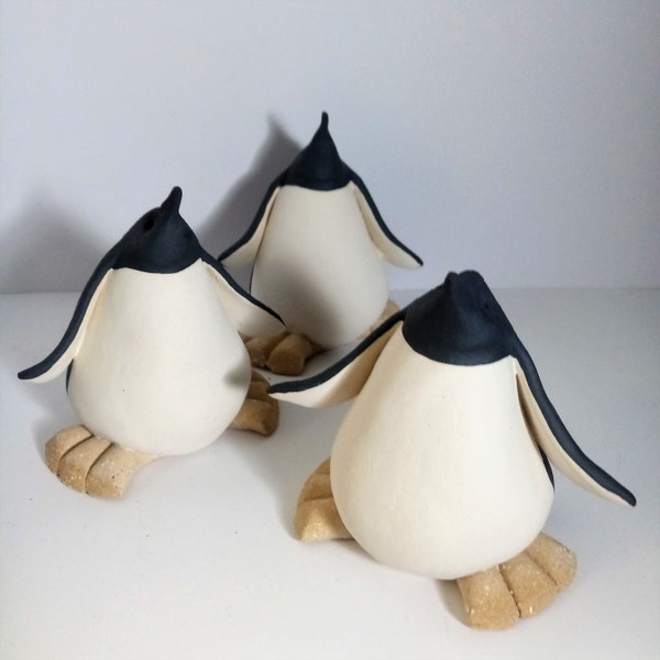 hand sculpted and hand painted ceramic penguins plain ones